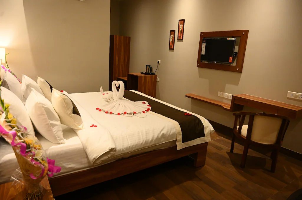 Deluxe room at Neel Clarks Inn Express Agra with added space, seating arrangement, and room décor