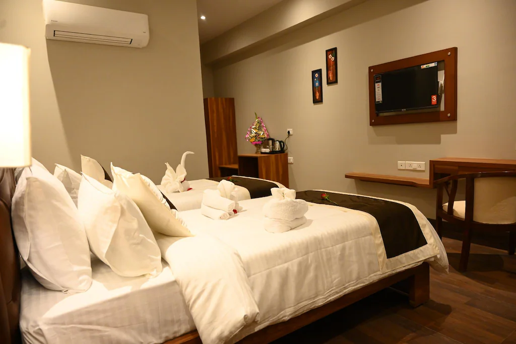 Deluxe room at Neel Clarks Inn Express Agra with added space, seating arrangement, and room décor