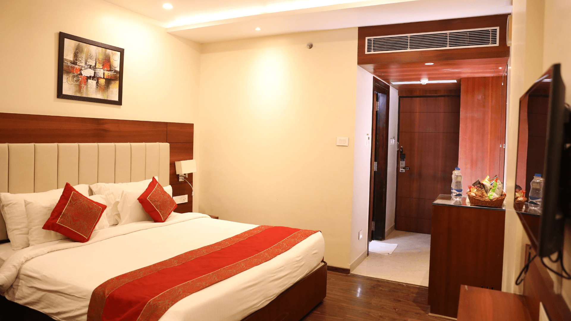 Executive room at Hotel Tridev Varanasi with work-friendly layout and organized furniture