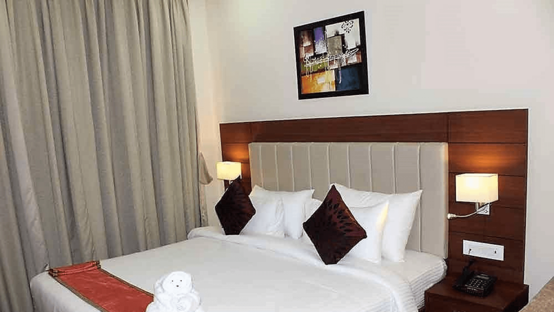 Deluxe room at Hotel Tridev Varanasi showing added space and seating area