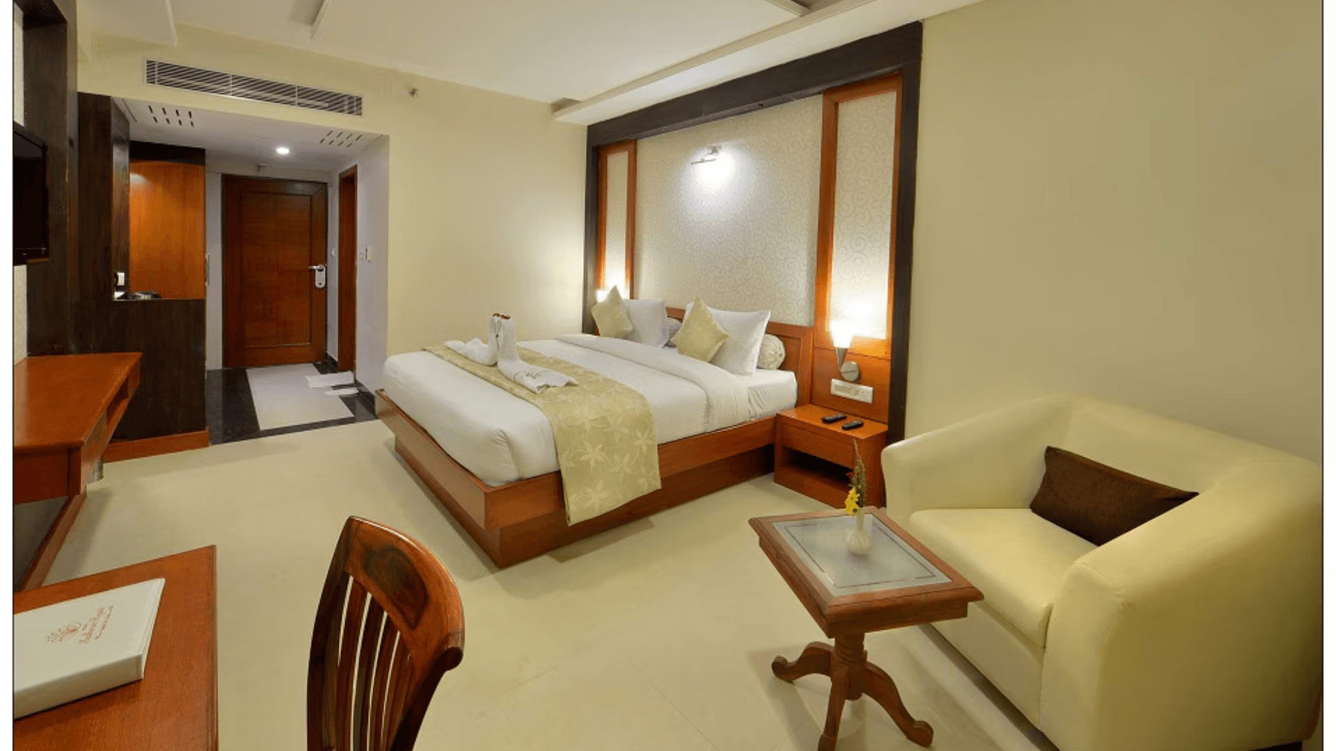 Deluxe room at Hotel Madhuram Royale Jodhpur featuring bed, seating area, and warm décor