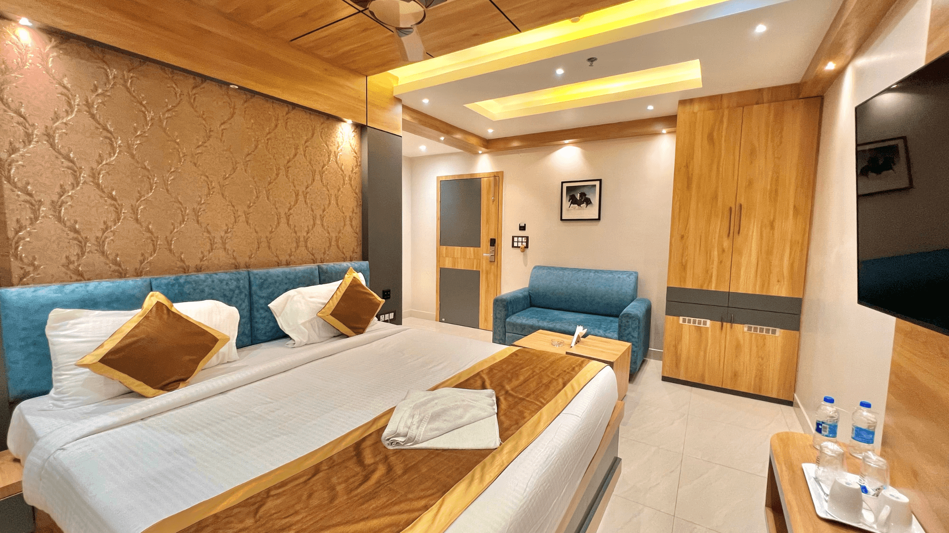 Executive room at The Magnum Deoghar with workspace and bed visible