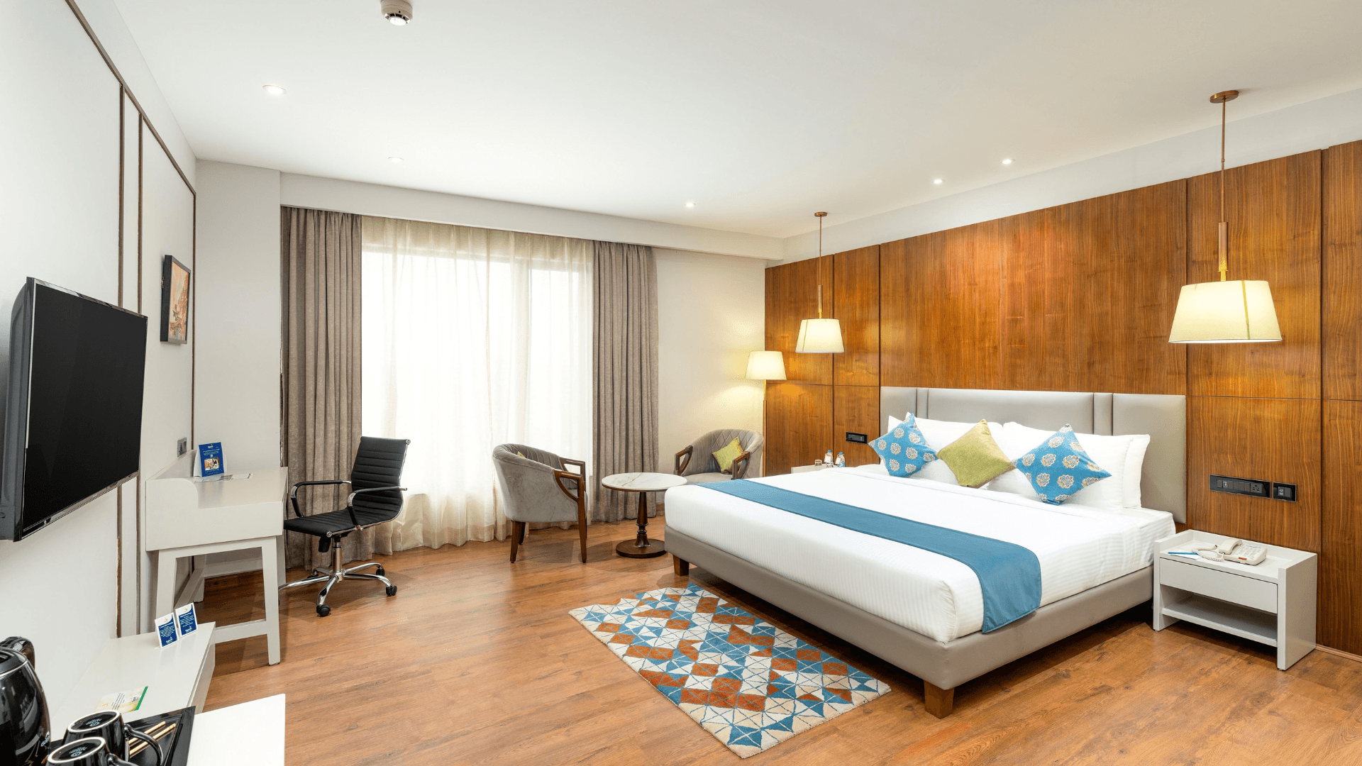 Superior room at Cygnett Inn Imperial, Tezpur offering spacious interiors and work desk