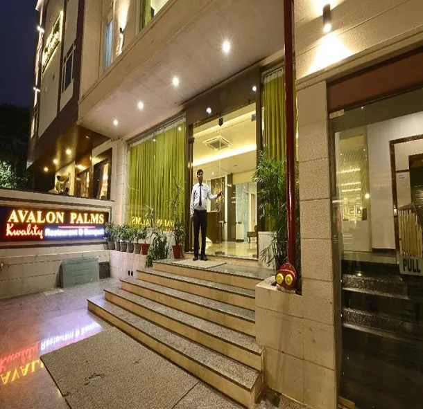 Hotel entrance of Hotel Avalon Palms Agra with exterior façade and driveway access
