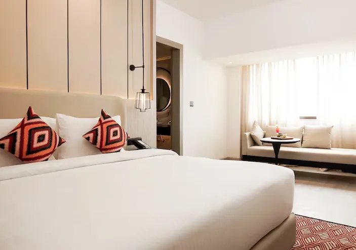 Executive room at Golden Tulip Lucknow featuring spacious layout and refined furniture details