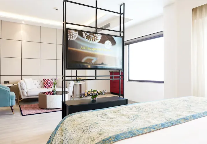 Suite room at Golden Tulip Lucknow with separate living area and structured layout