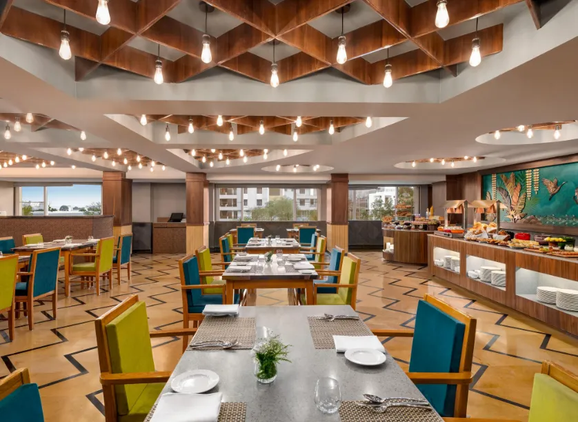 Restaurant at Howard Johnson by Wyndham Udaipur displaying dining tables and interior setup