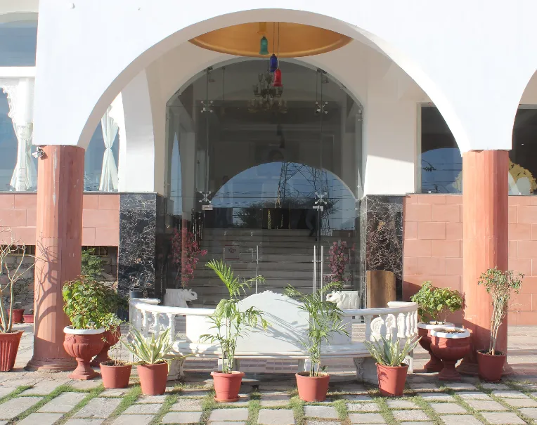 Entrance of Regenta Central Mewargarh Udaipur showing exterior façade, signage, and driveway access