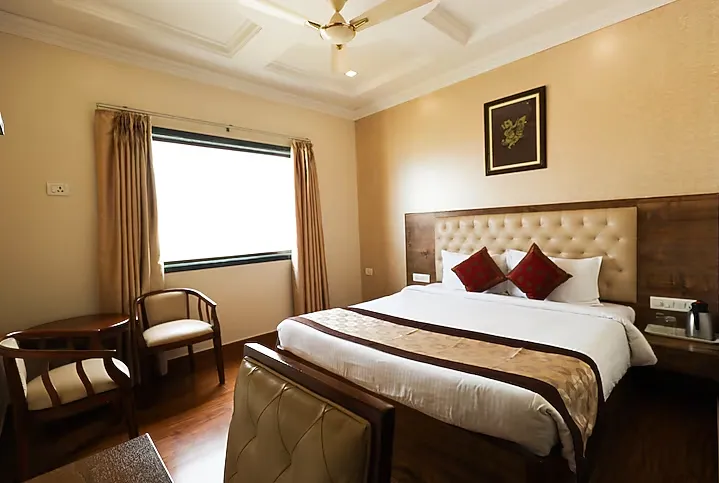 Superior room at Wingston A Treehouse Hotel Mathura offering upgraded interiors and restful layout