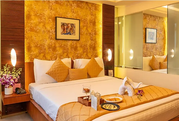 Standard room at Regenta Orko’s, Kolkata with modern interiors and comfortable bedding