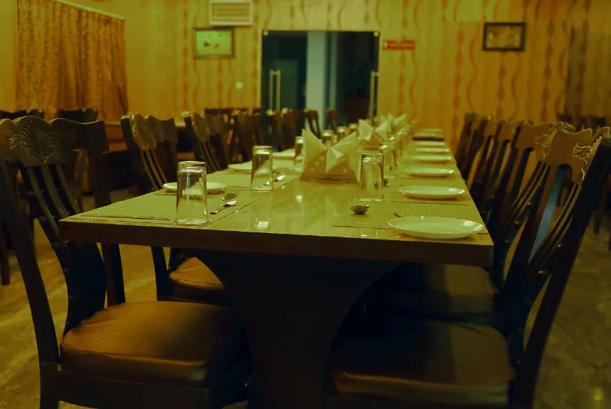 Restaurant at Hotel Shiv Vilas Palace Bharatpur with dining tables and décor