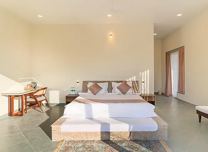 Executive styled suite at Kavish Kutumb Villa Kumbhalgarh with bed and workspace area
