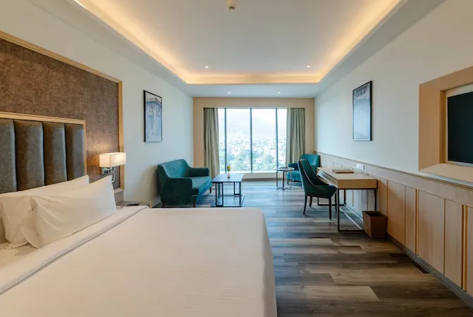 Premium room at Sarovar Portico Ajmer featuring bed and stylish interior