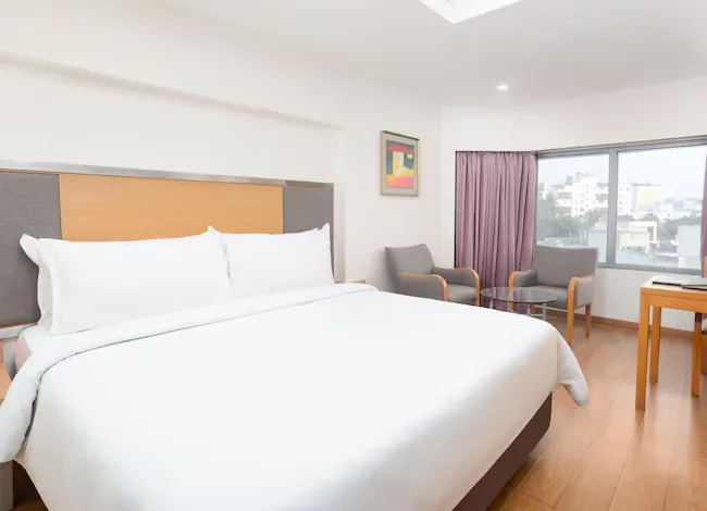 Superior room at The Residency Chennai with queen bed and work desk